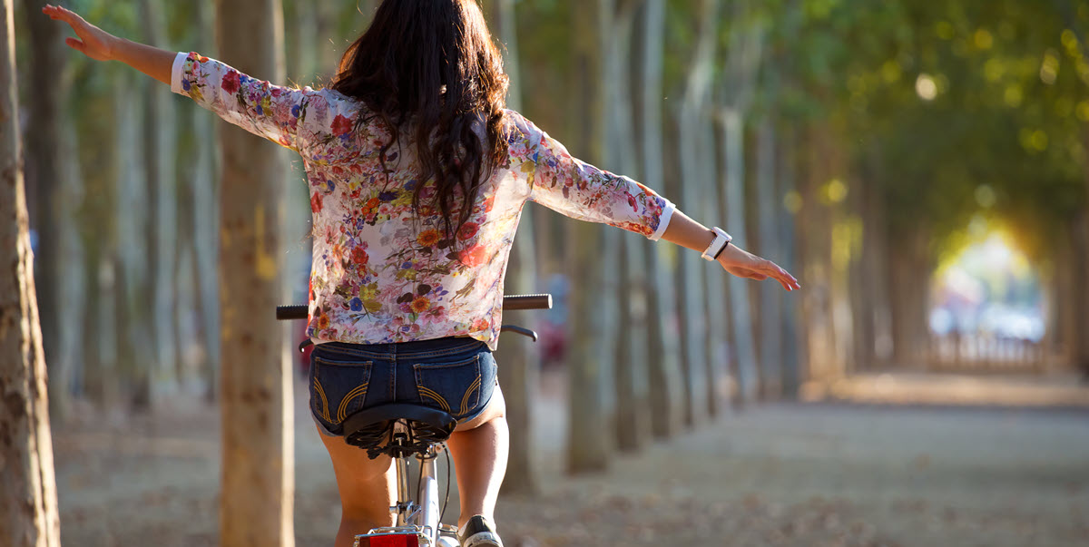 woman riding a bike, feeling free