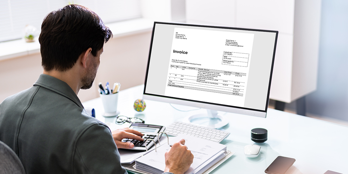 solopreneur writing an invoice